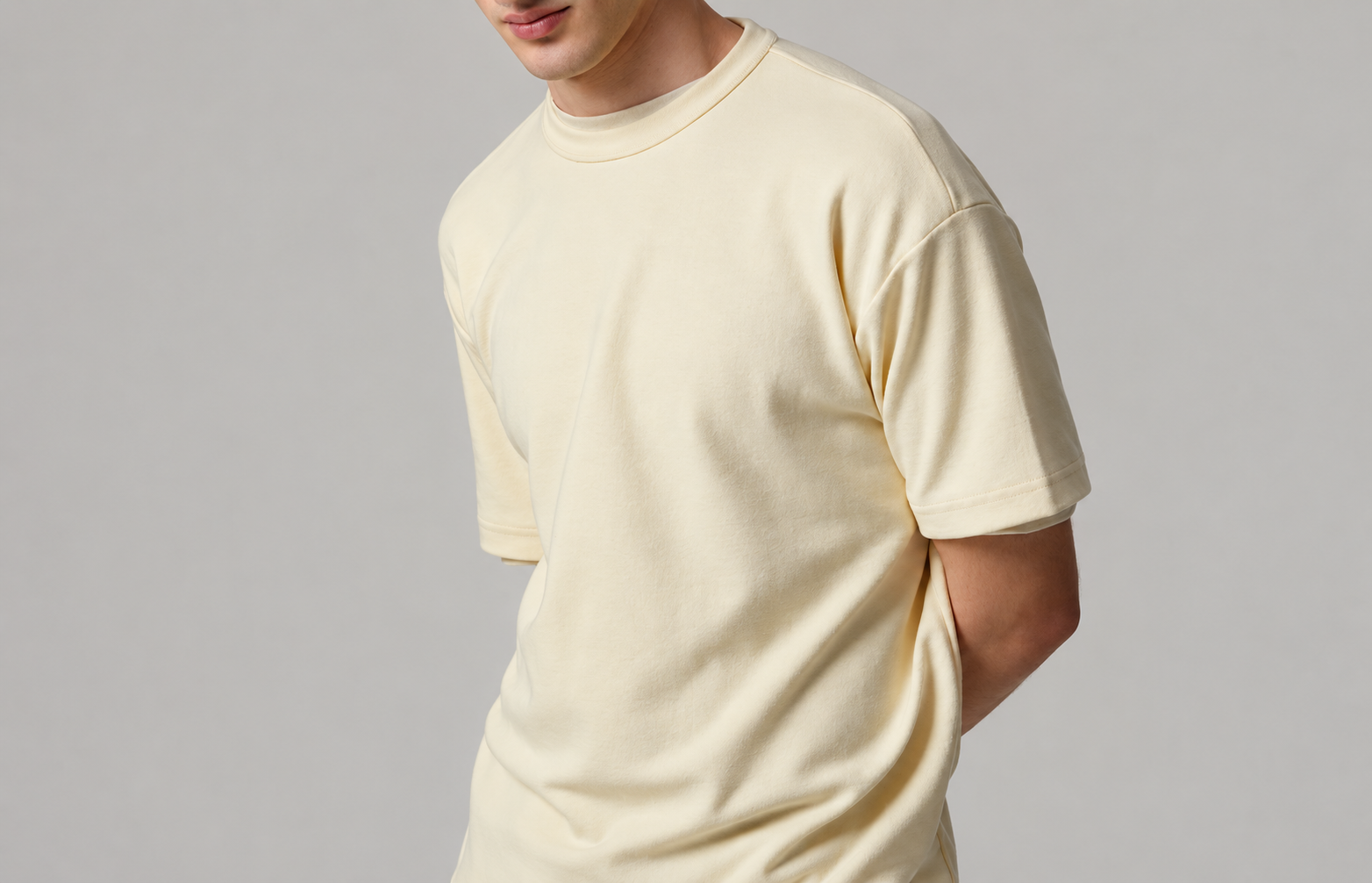 Model wearing a cream heavyweight t-shirt