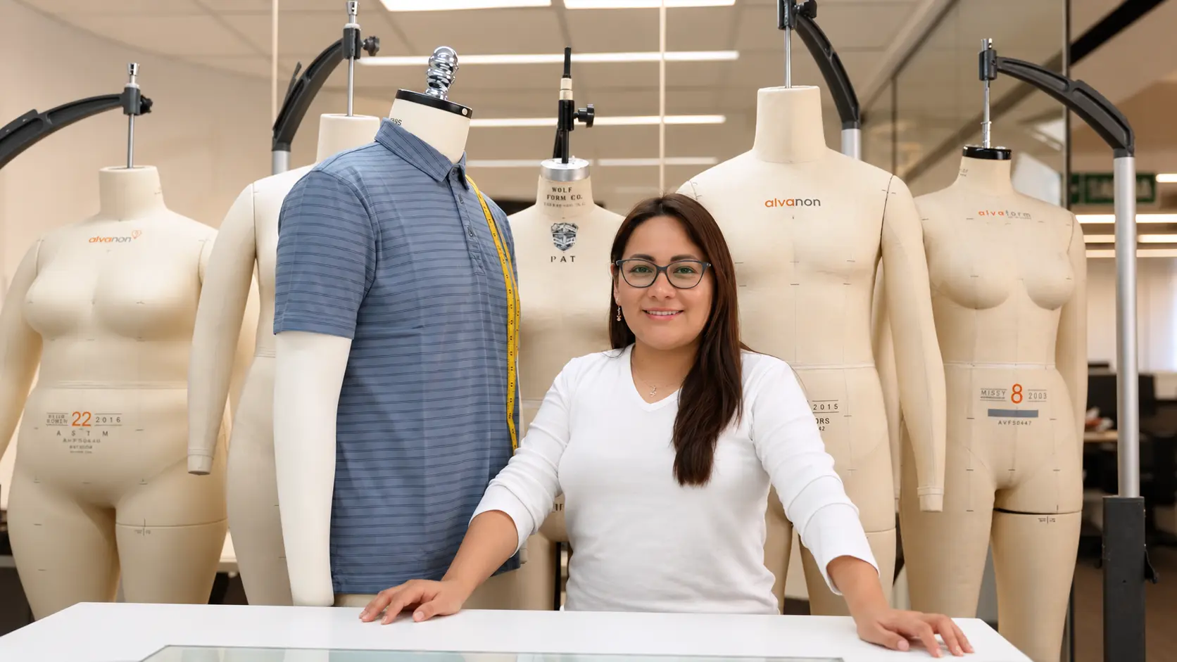 WTS team member among fitting mannequins