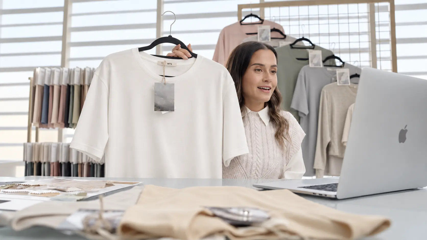 WTS team member presenting a finished white tee