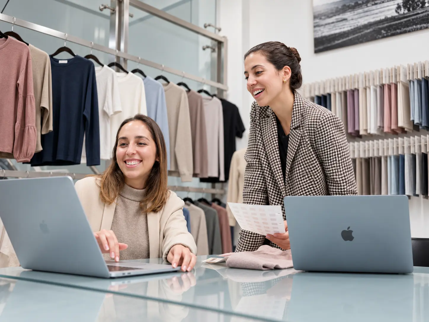 Two WTS teammates reviewing styles at the showroom table
